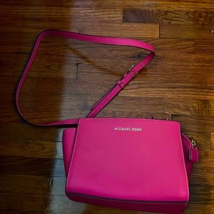 Pink crossbody Michael Kors bag